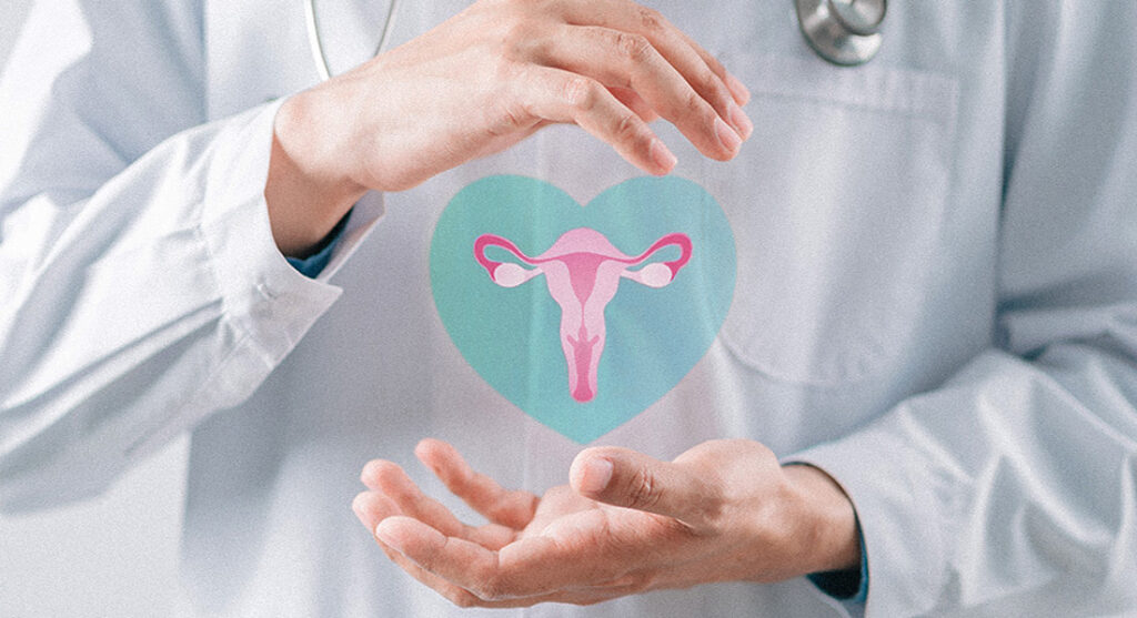 Doctor in a white coat holding a virtual uterus in a teal heart.
